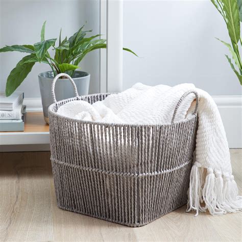 wicker basket for blanket storage.